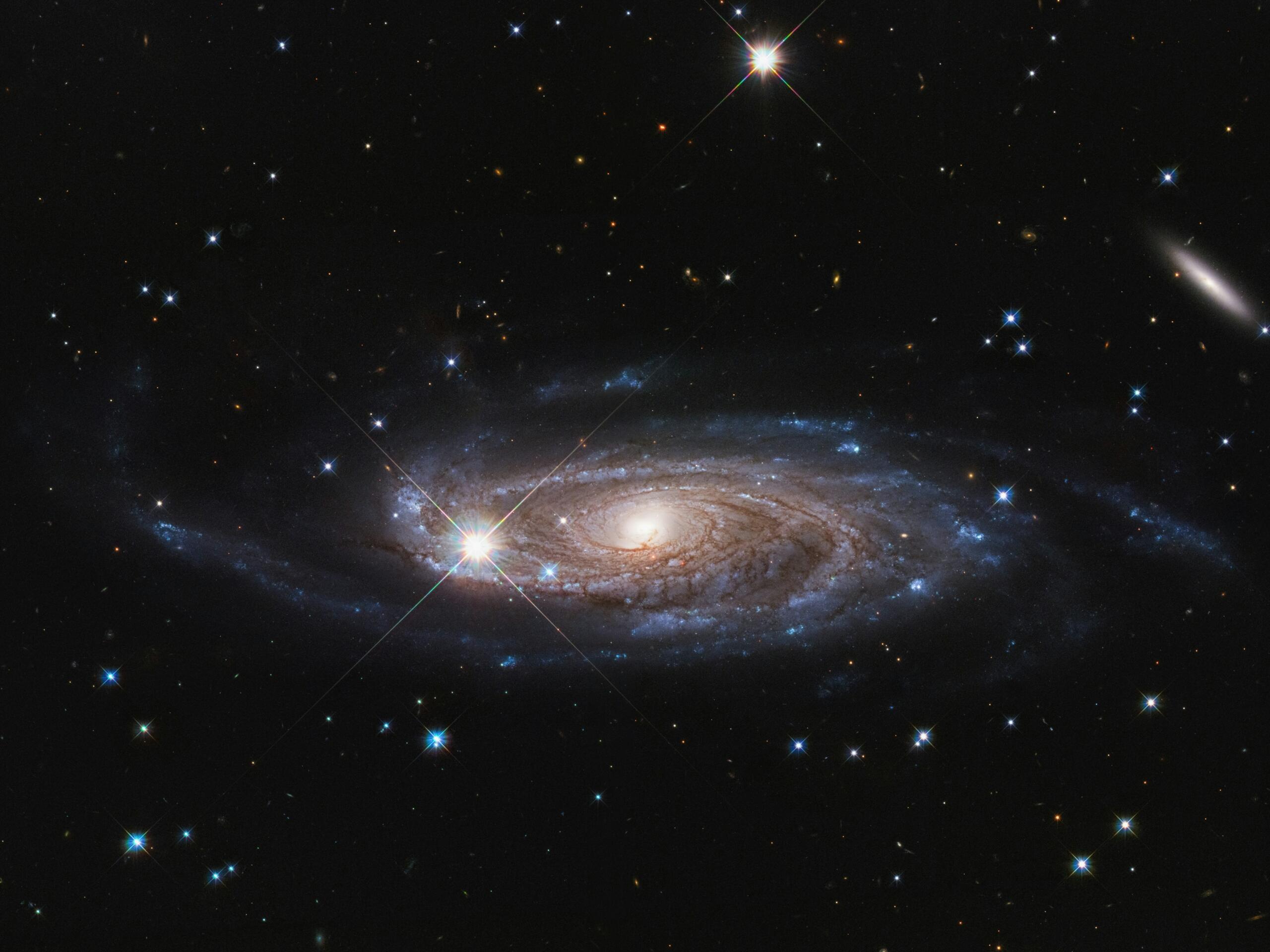A spiral galaxy with stars in the background